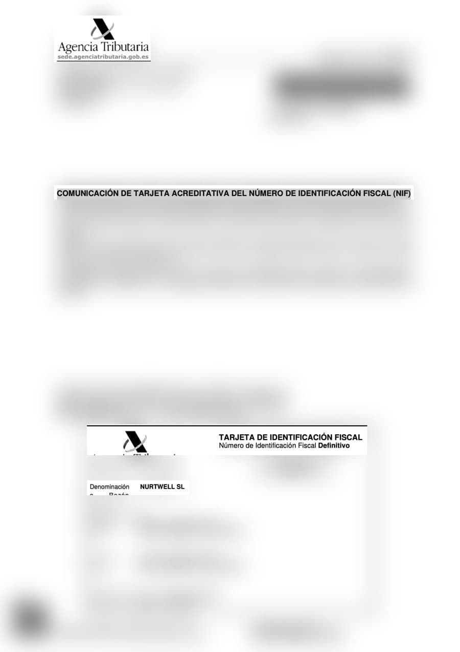 Tarjeta del NIF definitivo de la empresa, con número y direcciones desenfocados